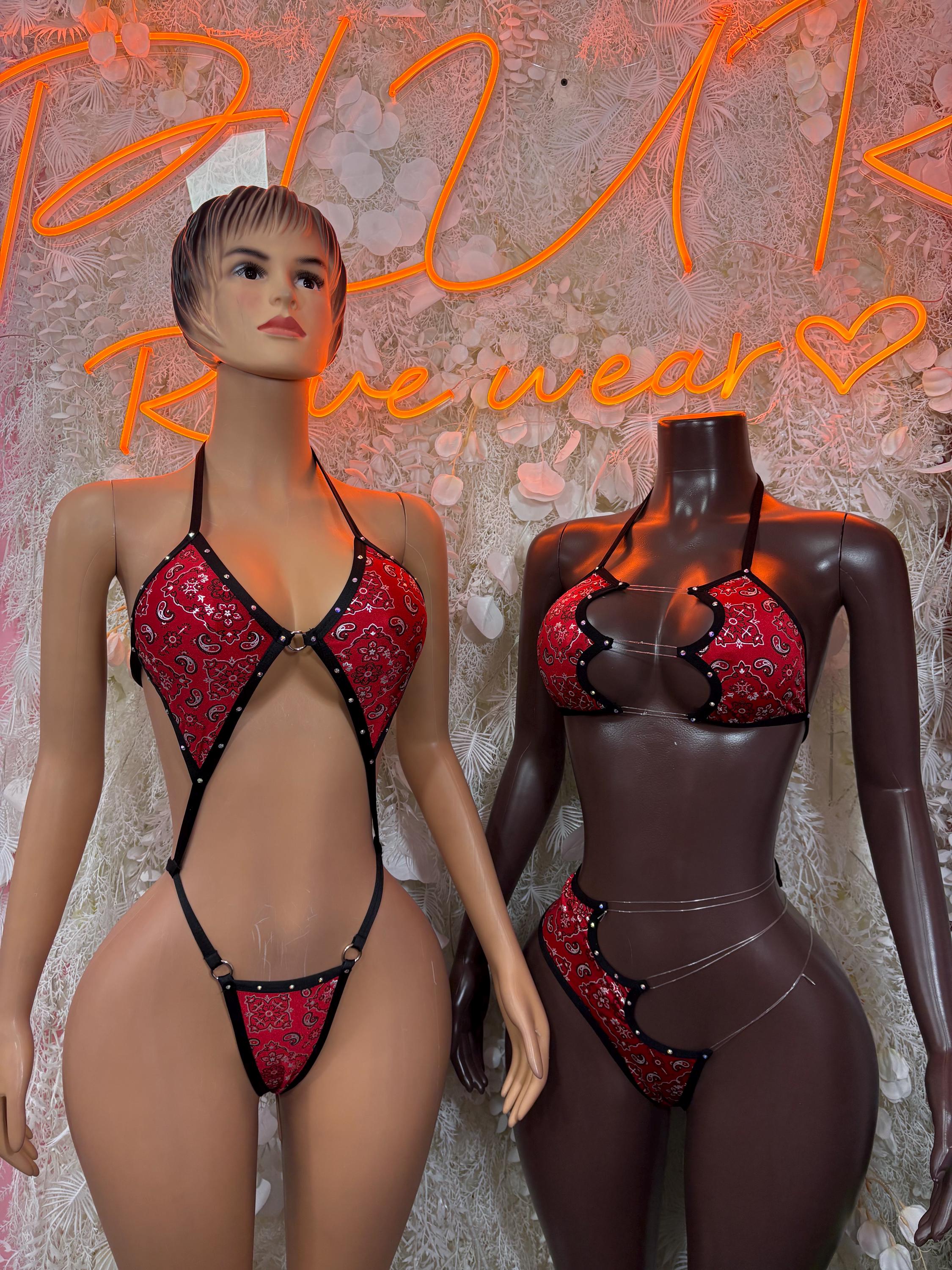 Red bandanna print one-piece on mannequin with black trim, halter and low back