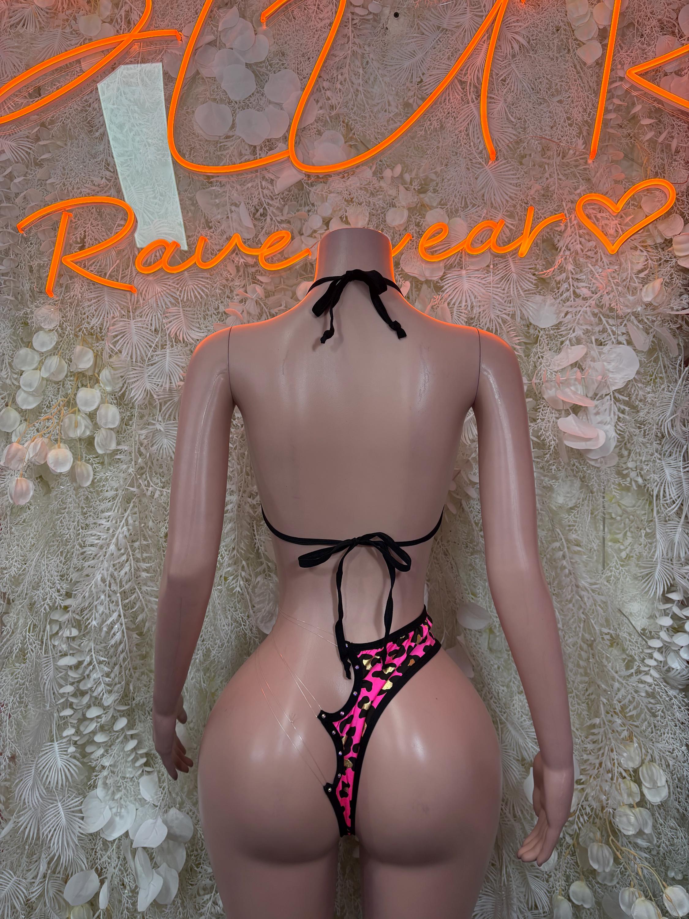 Pink leopard print two-piece with black back-tie triangle top and matching high-cut bottoms
