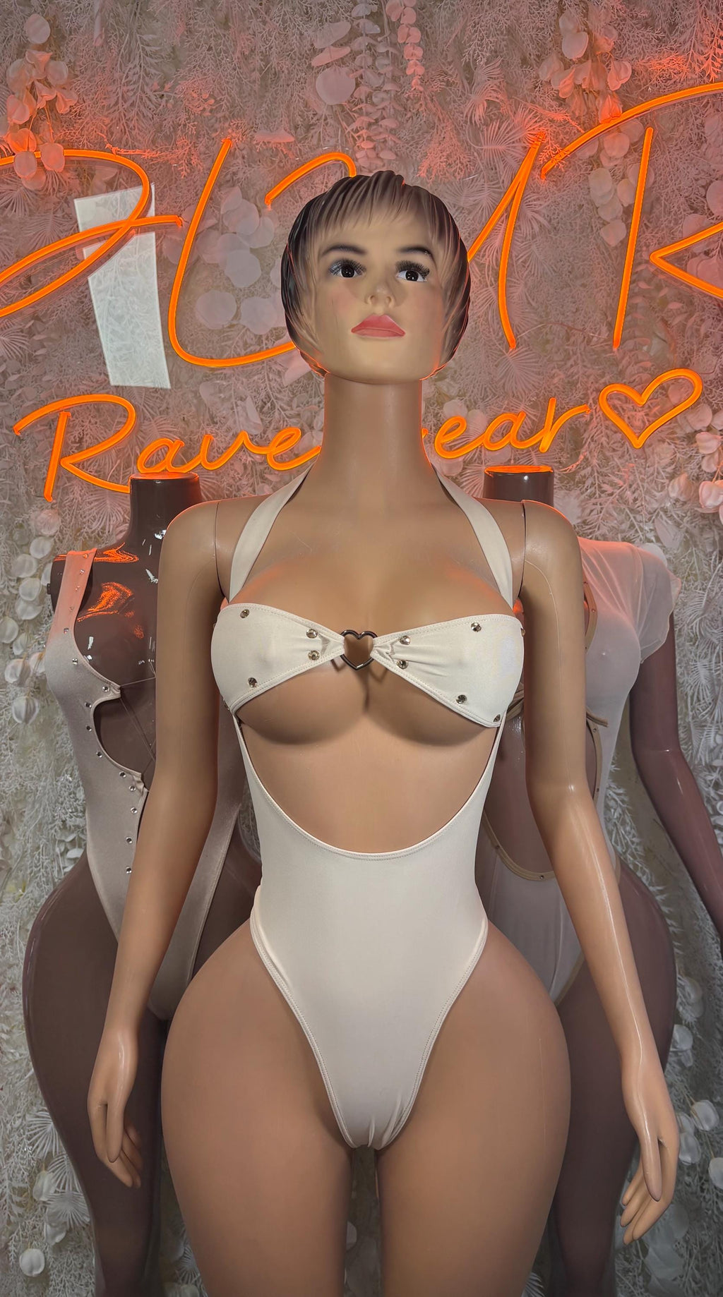 White one-piece festival bodysuit with bow front and high-cut legs