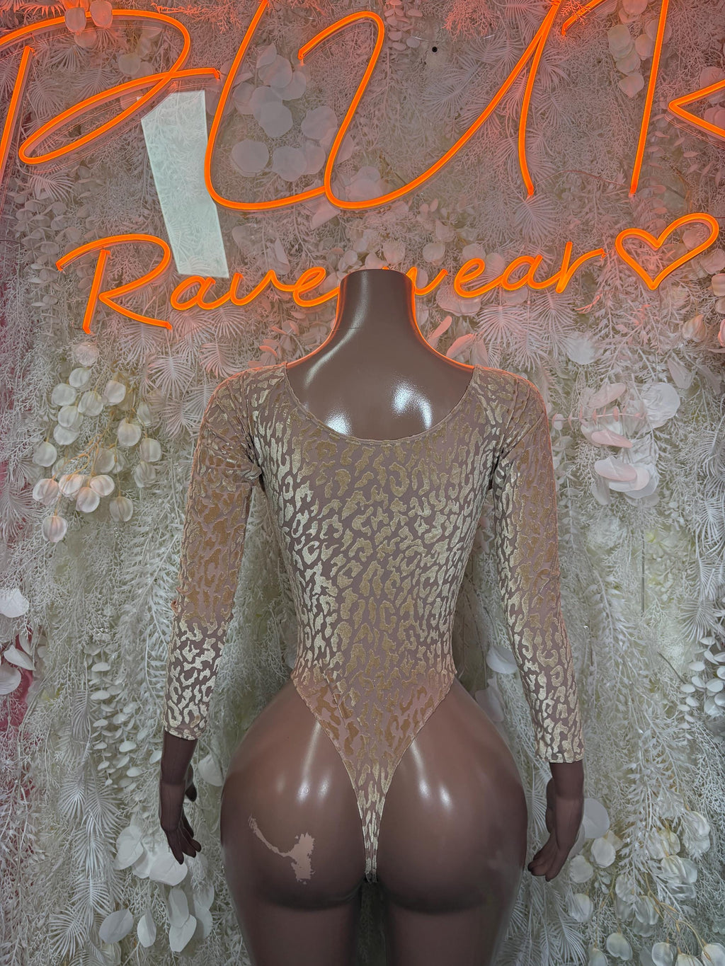 Tan long-sleeve snakeprint bodysuit with scoop neck and sheer back cutouts