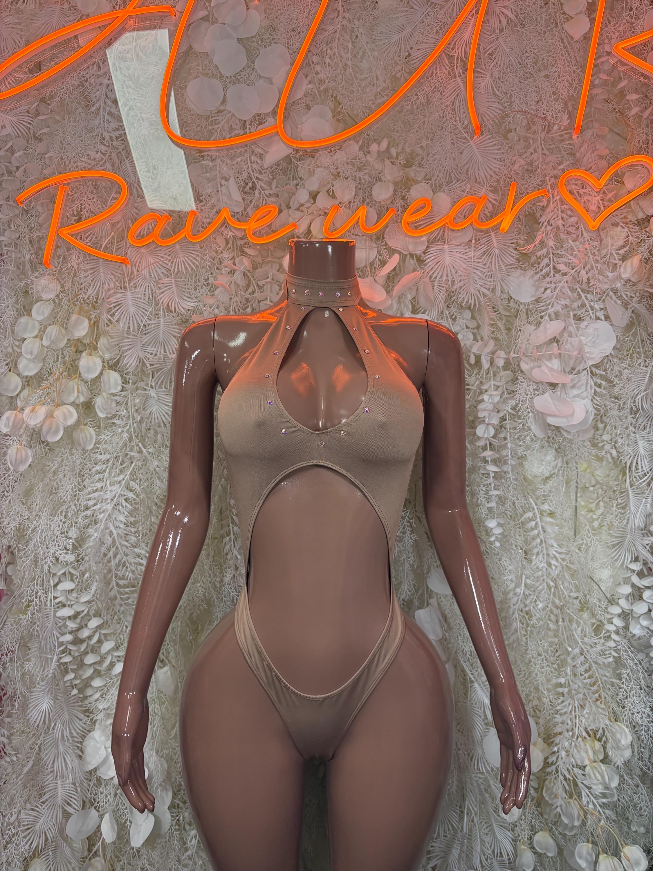 Tan one-piece bodysuit with deep oval cutout at chest and high-leg bottoms