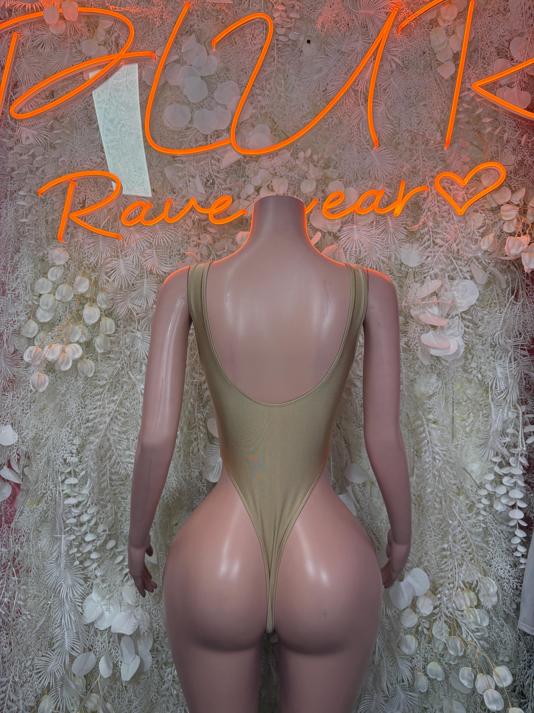 Gold one-piece sleeved bodysuit with deep open-back design