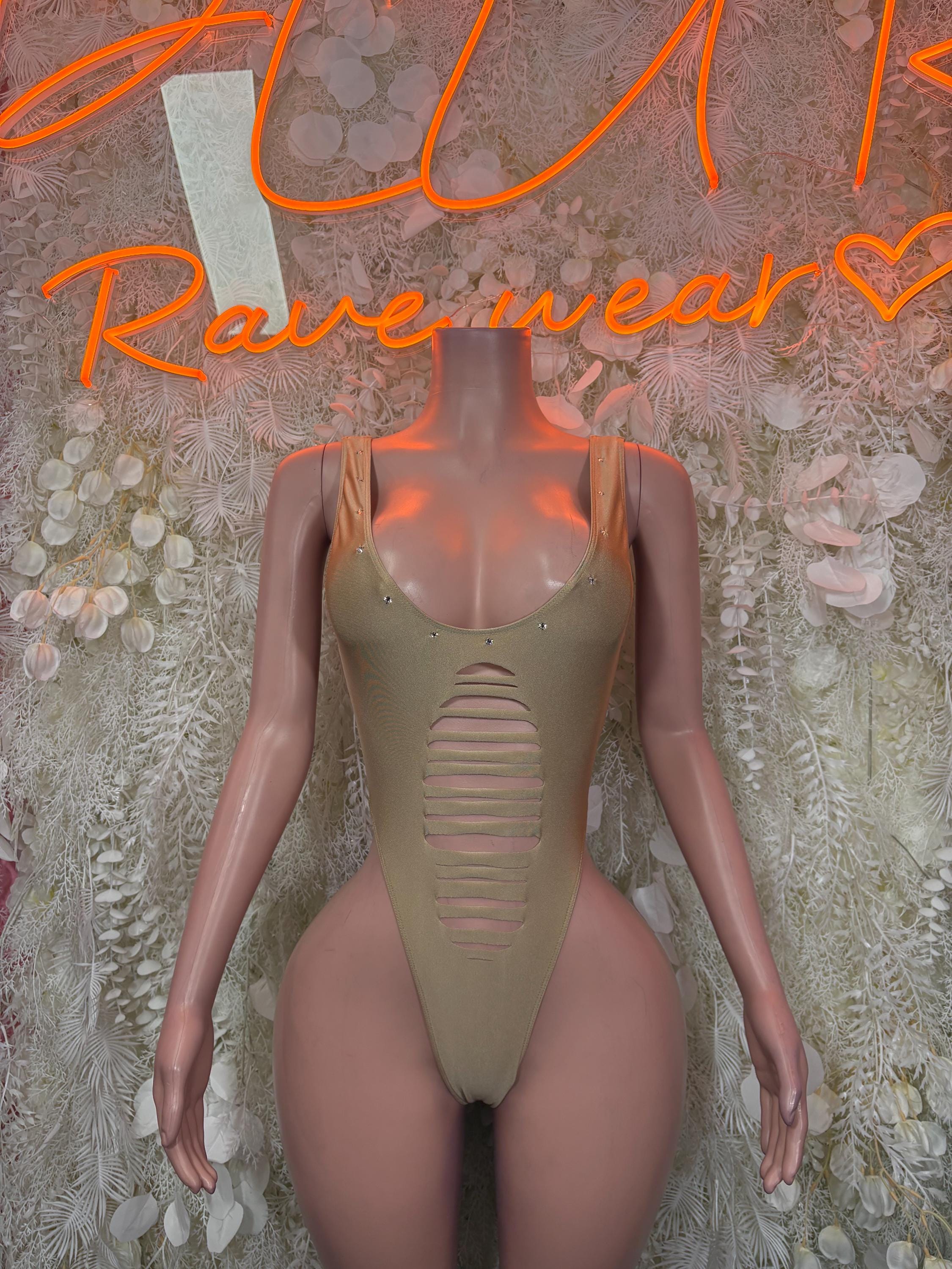 Gold one-piece sleeved bodysuit with scoop neckline and ribbed chest detail