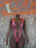 Pink glitter one-piece bodysuit with long sleeves and deep plunge neckline