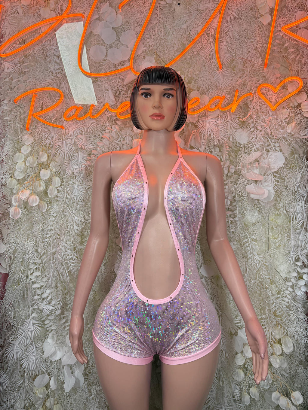 Pink metallic halter bodysuit with iridescent sheen, wide scoop cutout