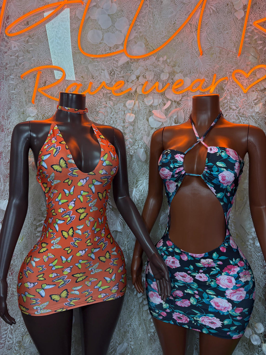 Two summer dresses: orange butterfly print and dark floral sleeveless halter