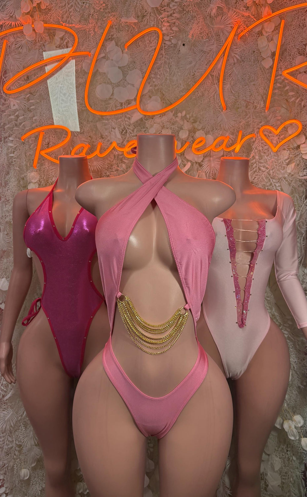 Pink and magenta bodysuit with halter straps and cross-front detail