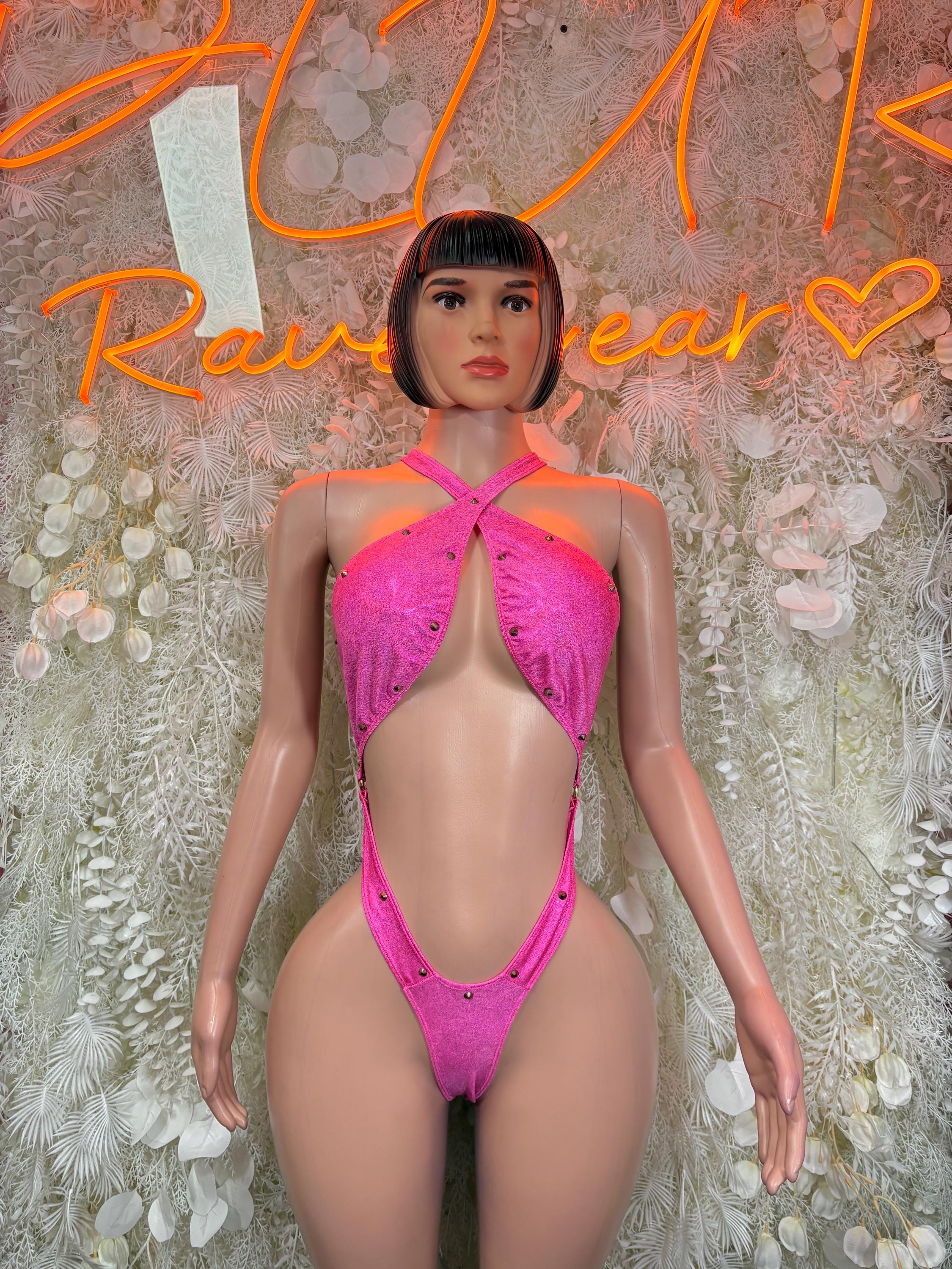 Pink glitter halter bodysuit with crisscross straps and thong back detail