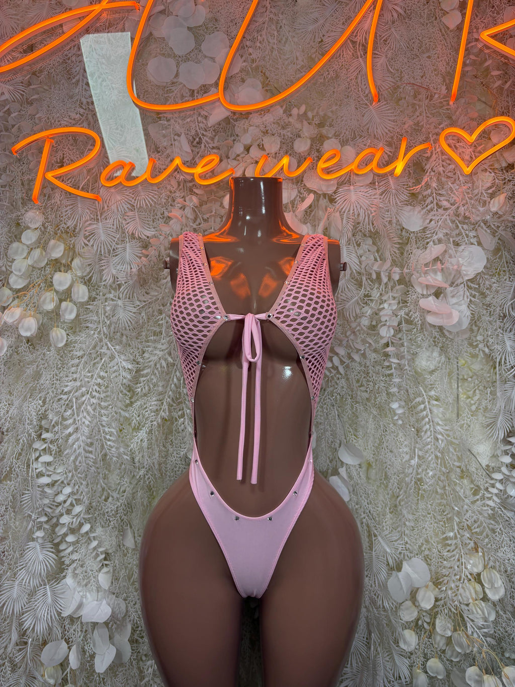 Pink fishnet dance bodysuit with open back and central lace-up tie detail