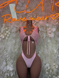 Pink fishnet dance bodysuit with open back and central lace-up tie detail