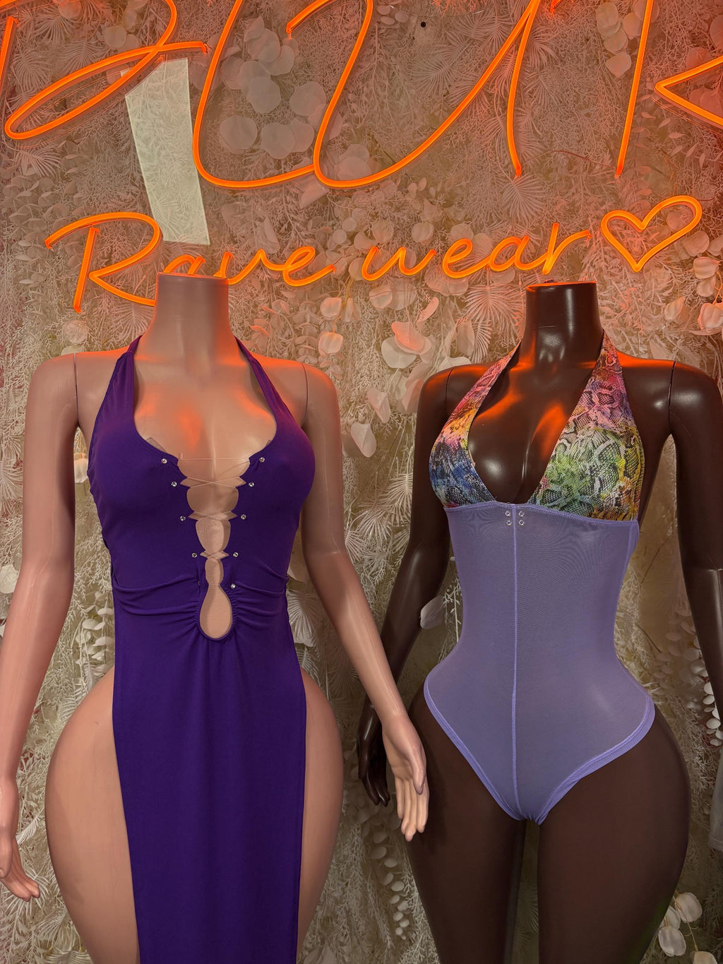 Purple one-piece bodysuit with V-neck and patterned lace chest detail