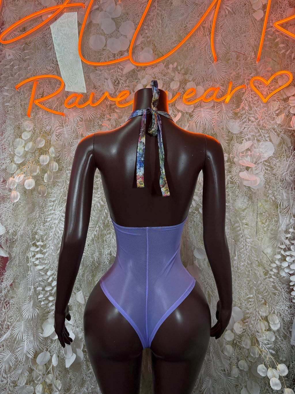 Purple one-piece bodysuit with open back and tie halter neck straps