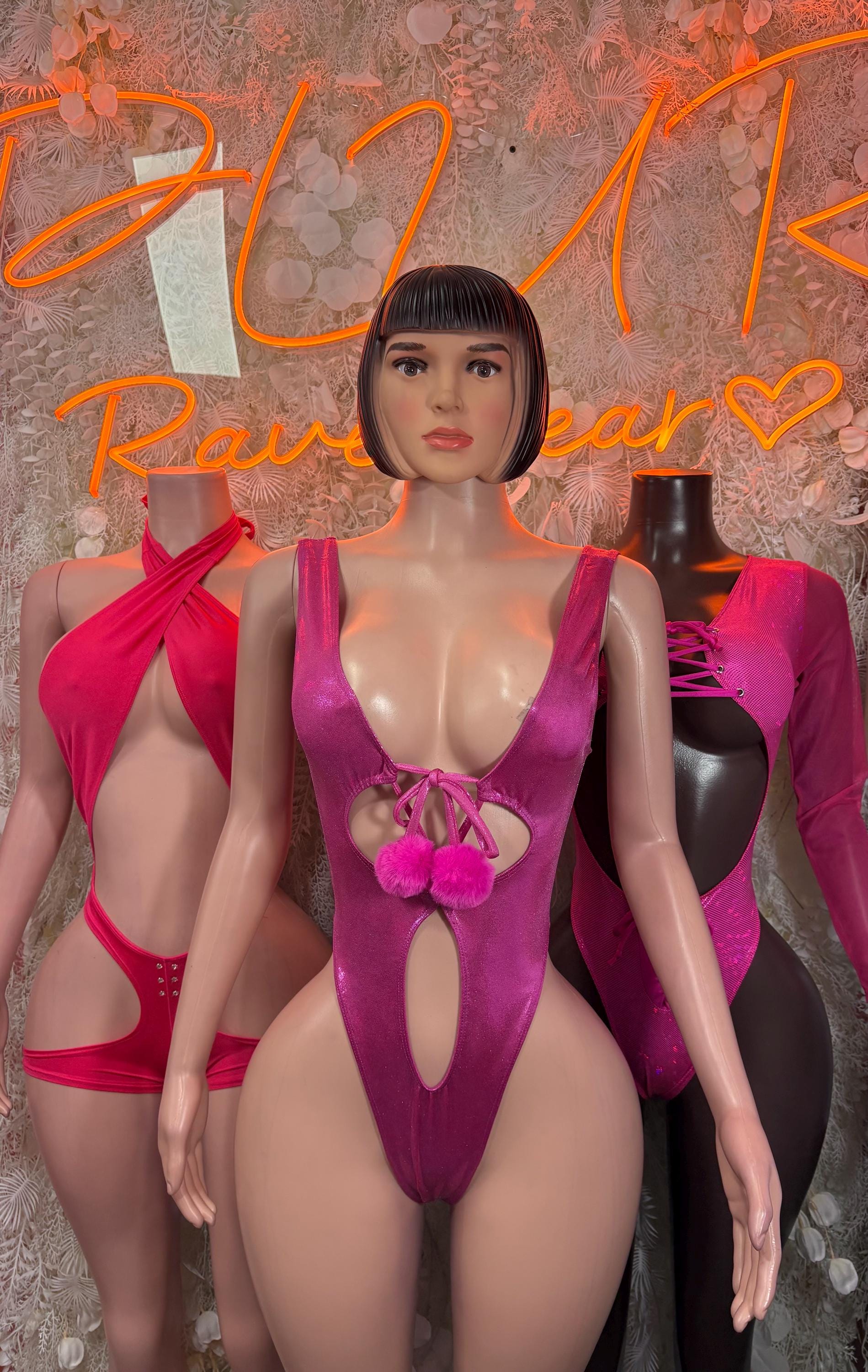 Pink one-piece bodysuit with keyhole chest cutout and tie halter