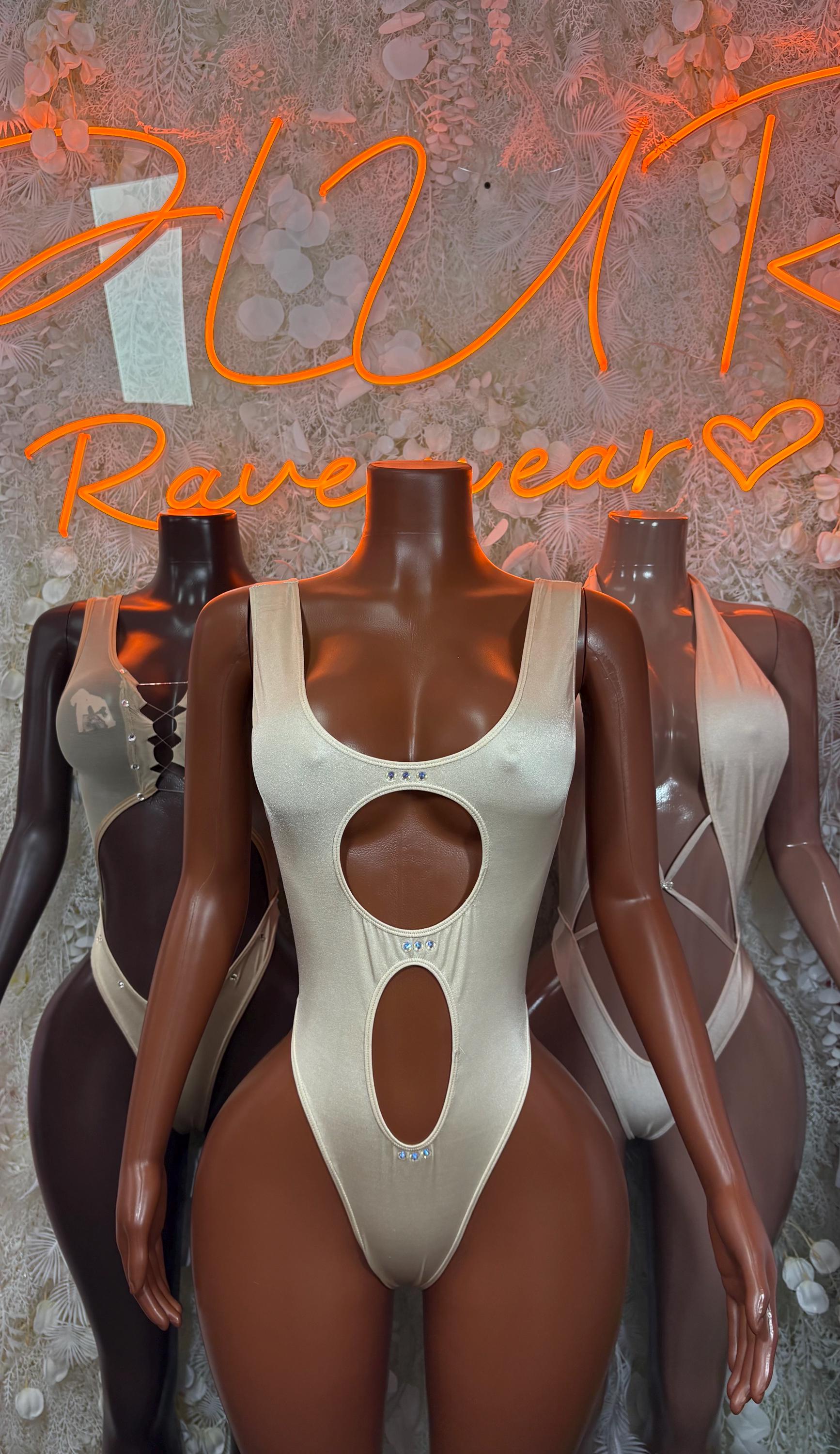 Cream cutout one-piece bodysuit shown on two mannequins, scoop front