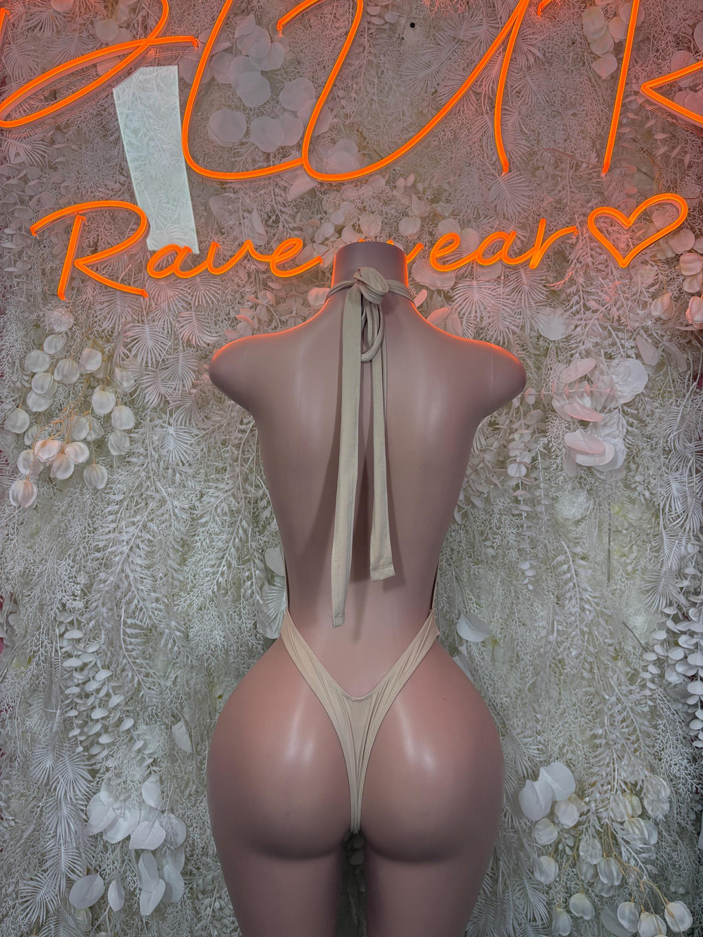 Beige backless bodysuit with long tie strings and cheeky cut