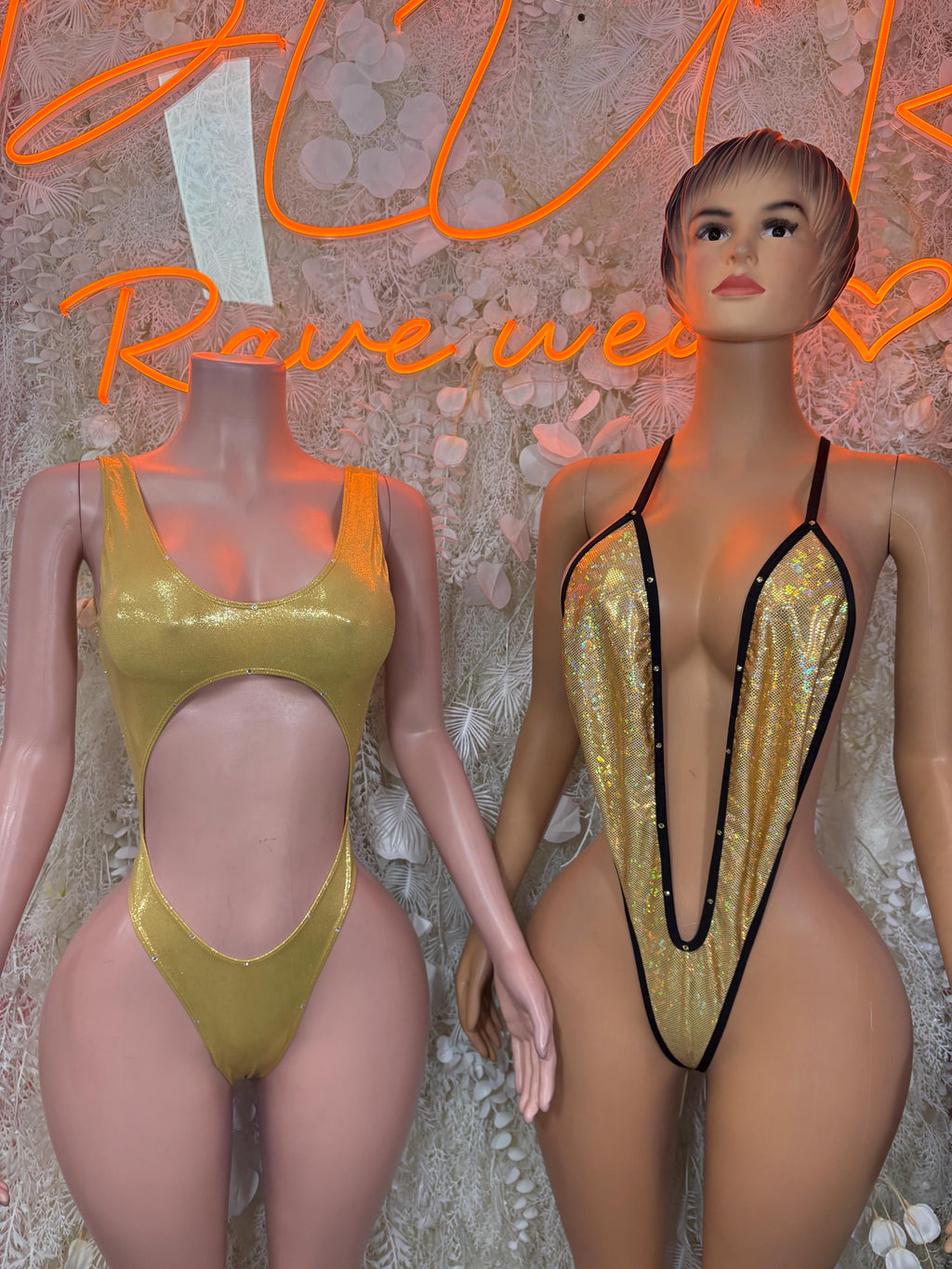 Two slingshot one-piece festival bodysuits: yellow and gold sequin with black trim