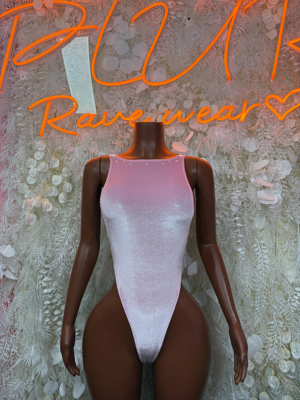 Pink velvet one-piece bodysuit, front halter neckline and high-leg cut