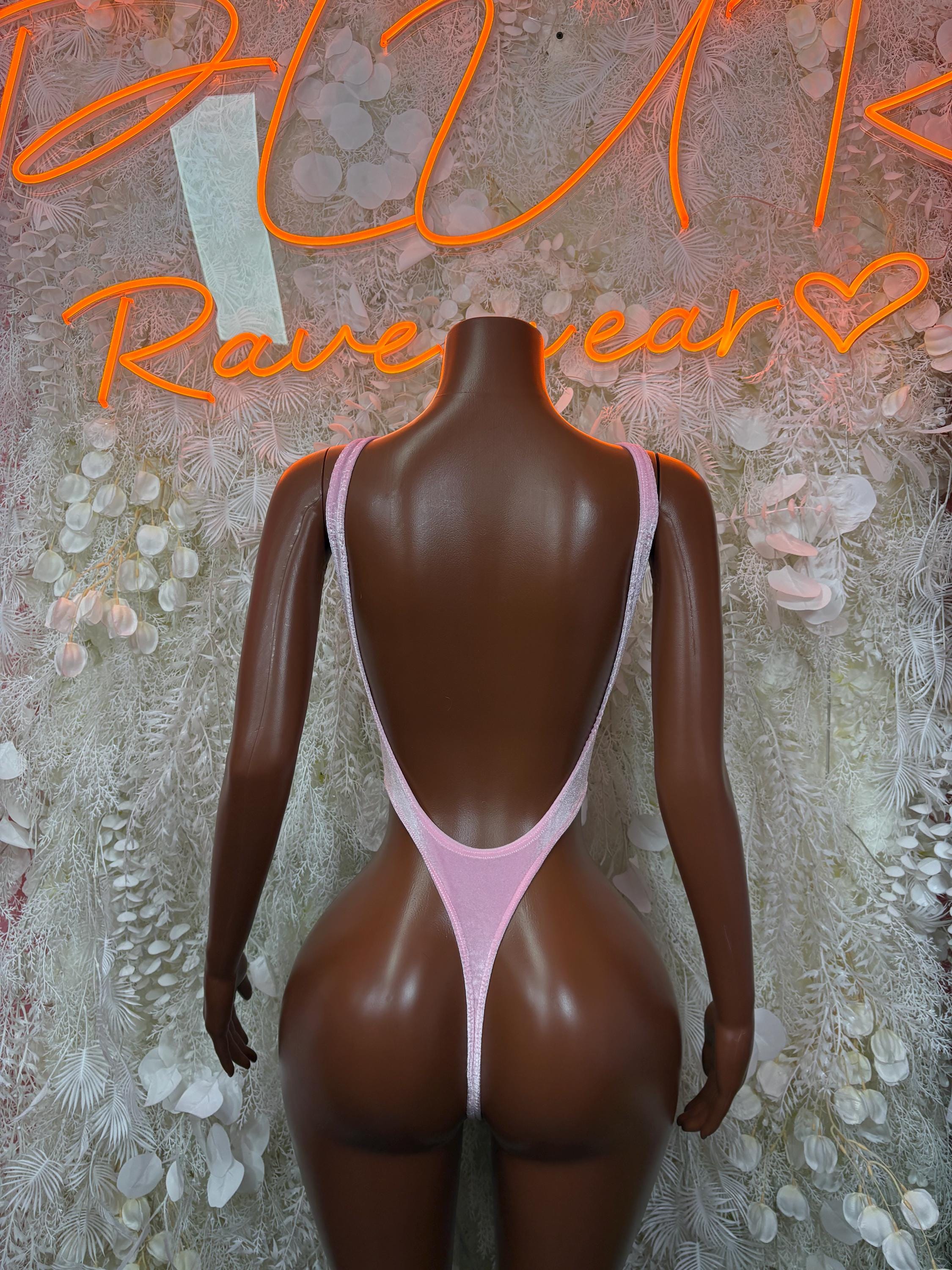 Pink velvet one-piece bodysuit, open back racerback straps, high-cut leg