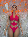 Pink halter one-piece bodysuit with ring cutout at waist