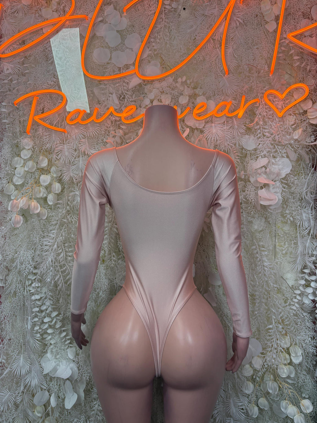 Nude sheer bodysuit with long sleeves and corset-style lace-up neckline