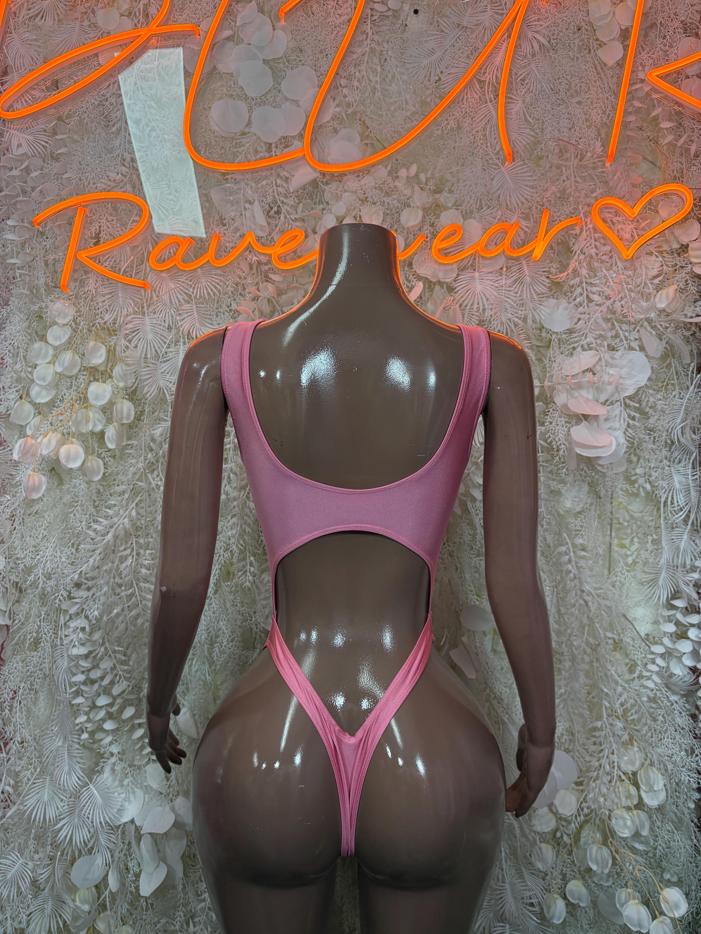 Pink one-piece bodysuit with strappy back and thong-cut bottom