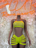 Lime green neon two-piece rave outfit with strapless tube top and high-cut striped shorts