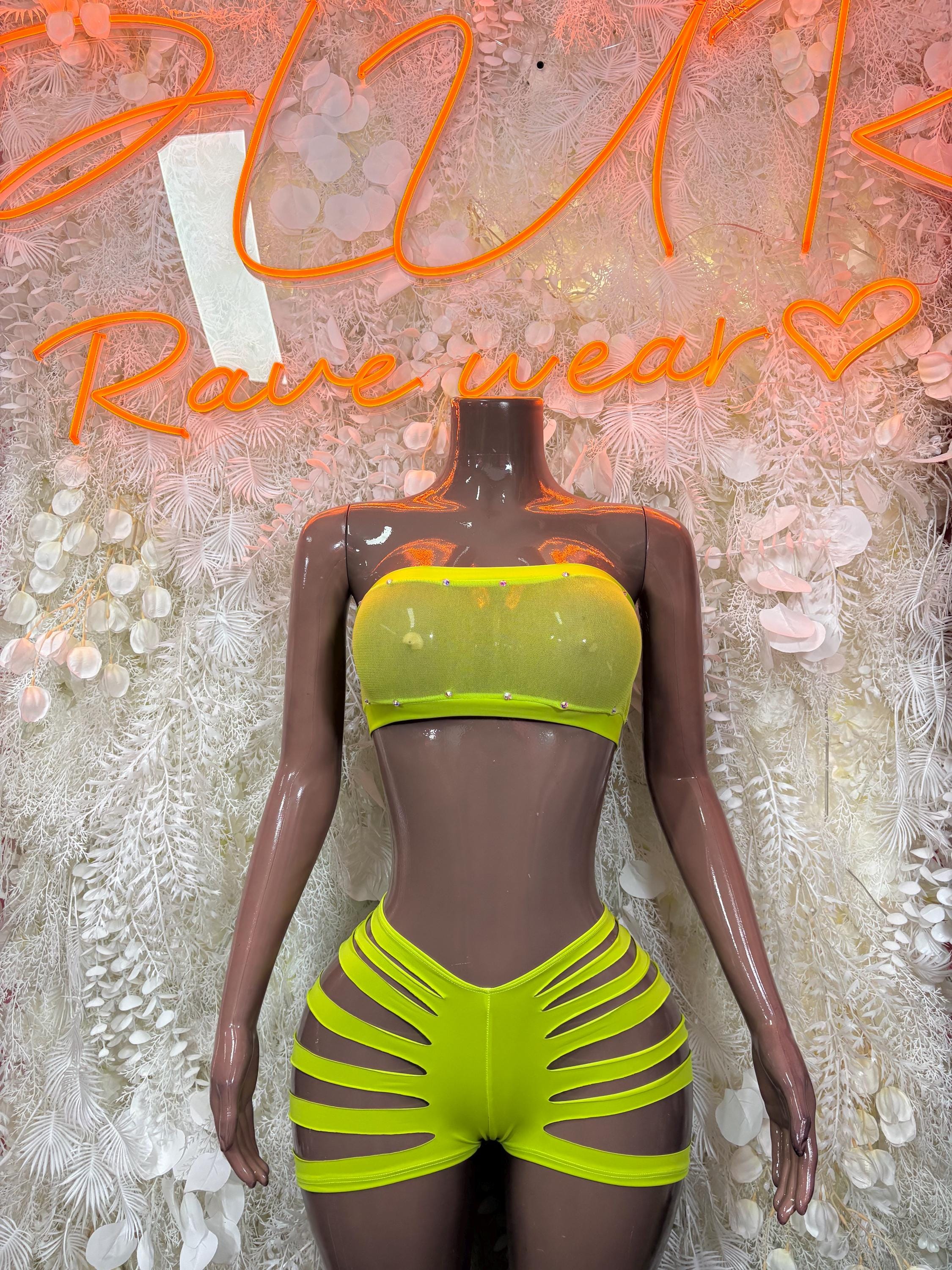 Lime green neon two-piece rave outfit with strapless tube top and high-cut striped shorts