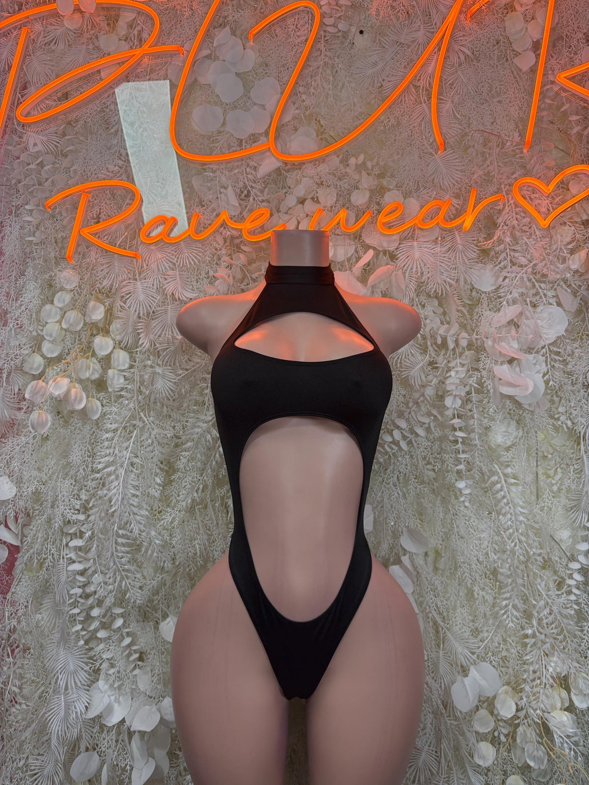 Black halter bodysuit with oval chest cutout and deep V back