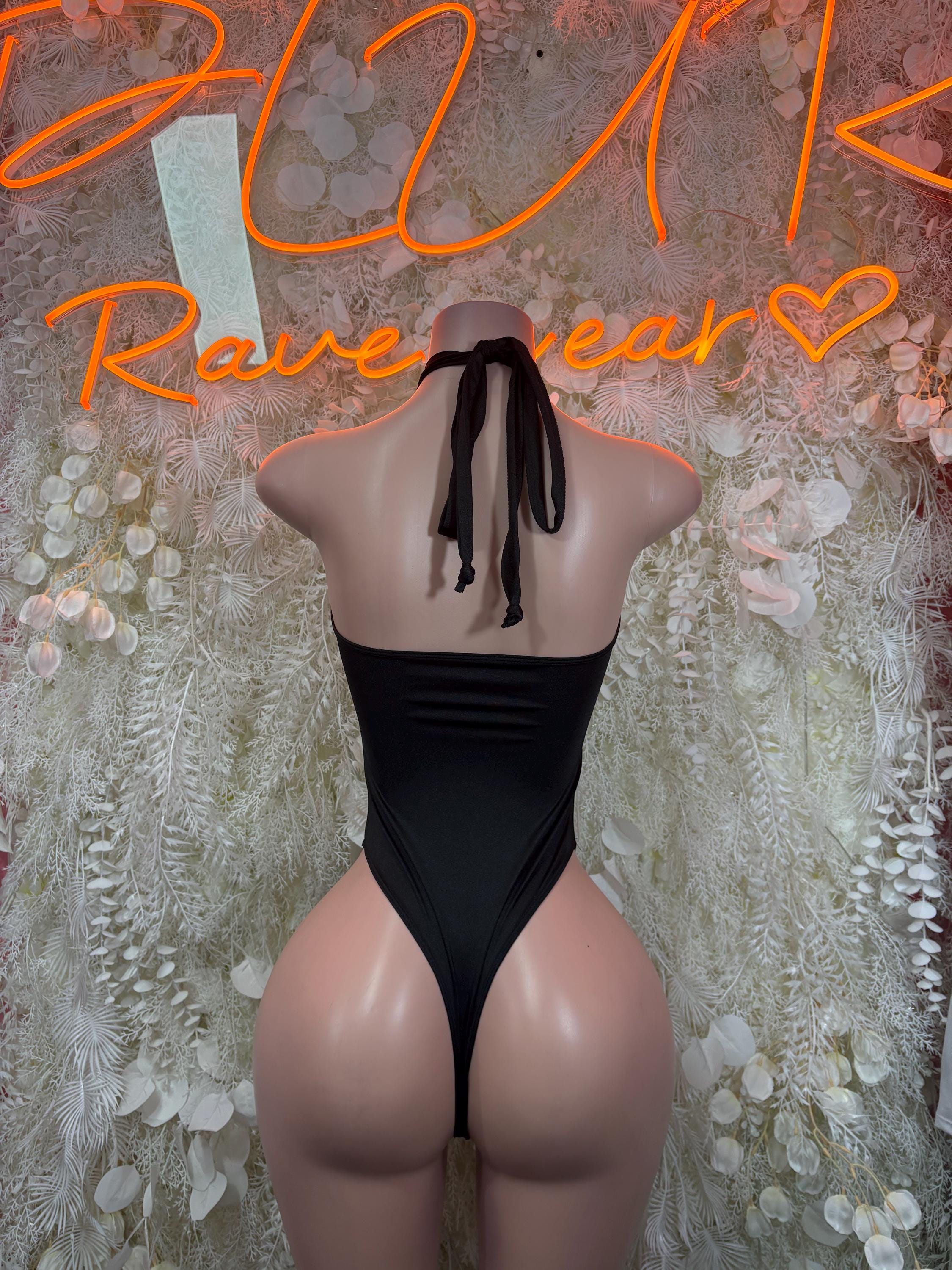 Black backless halter bodysuit with tie-back straps and high-leg cut