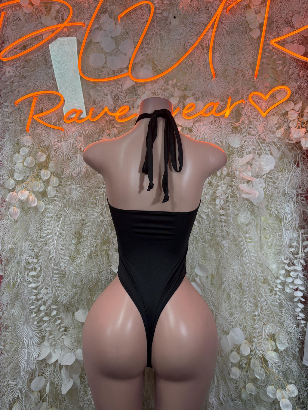 Black one-piece halter bodysuit with low back and tie straps