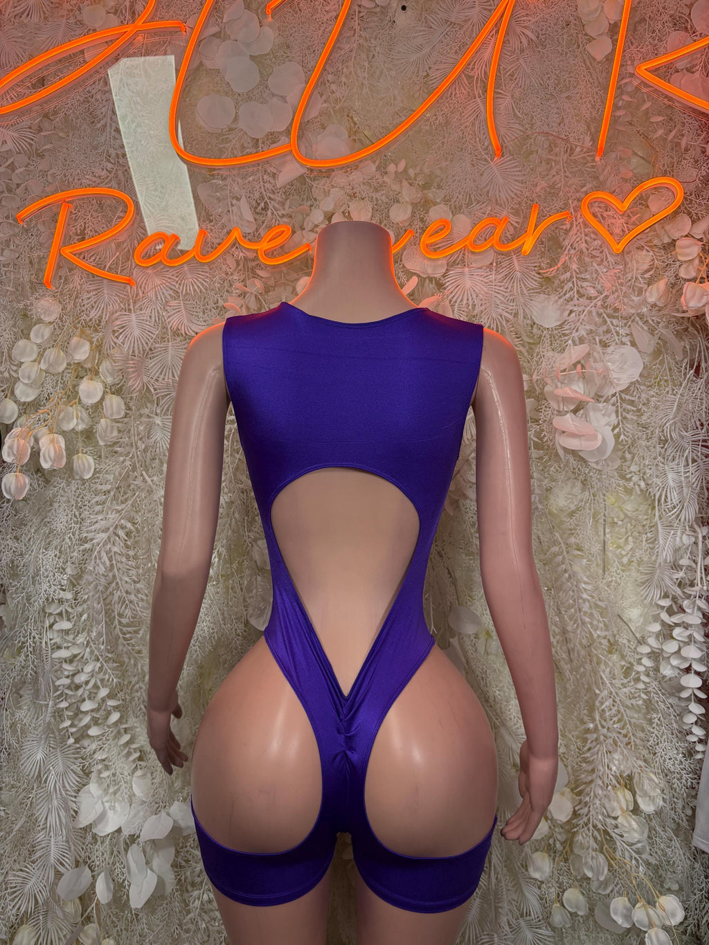 Purple one-piece dancewear with deep back V and cutout center