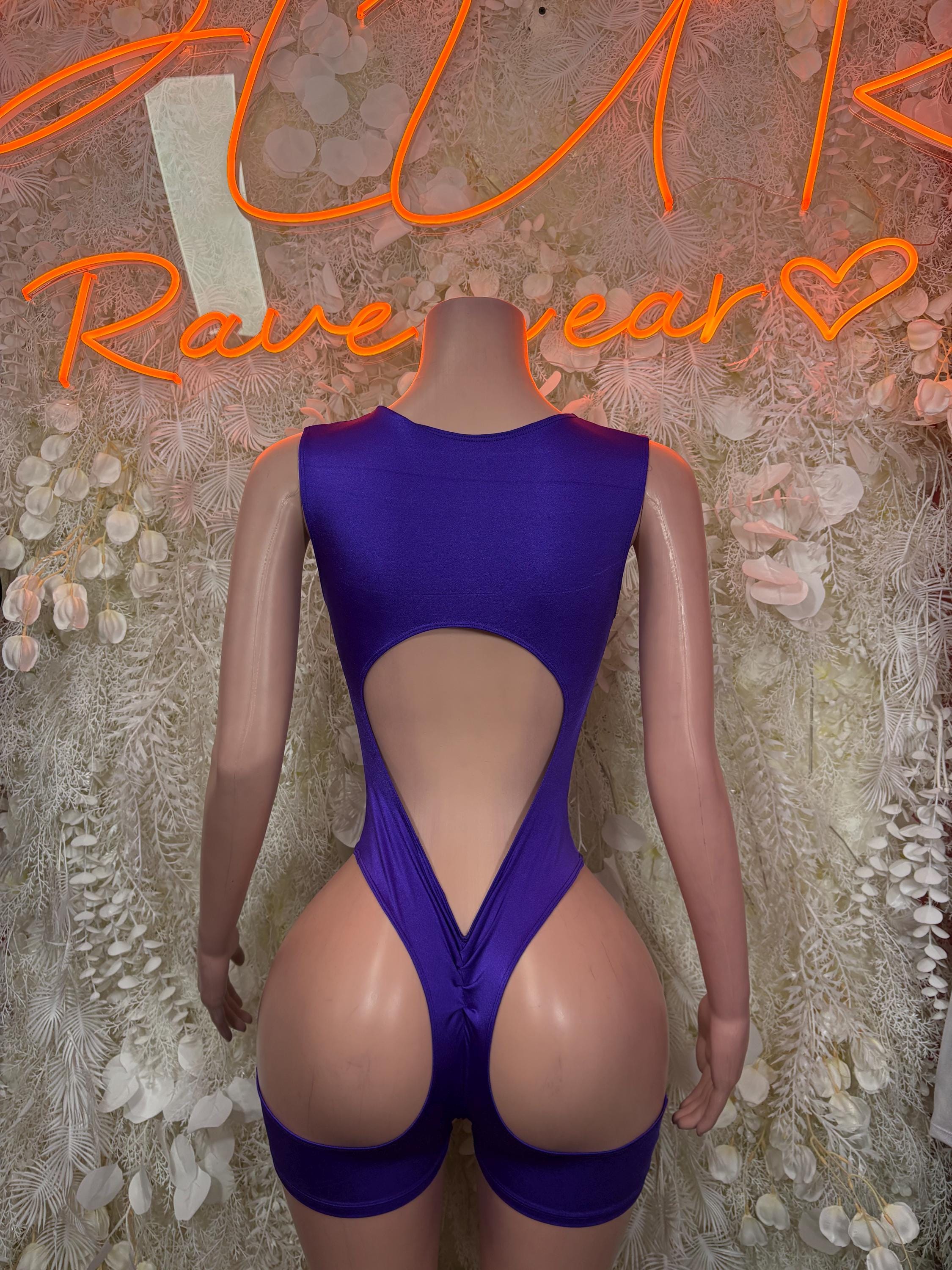 Purple one-piece dancewear with deep back V and cutout center