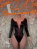 Black long-sleeve bodysuit with deep V neckline and red center trim