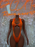 Orange one-piece bodysuit with deep V neckline and high-cut leg openings