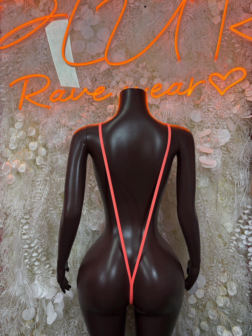 Orange festival one-piece bodysuit with deep V front and back cutouts