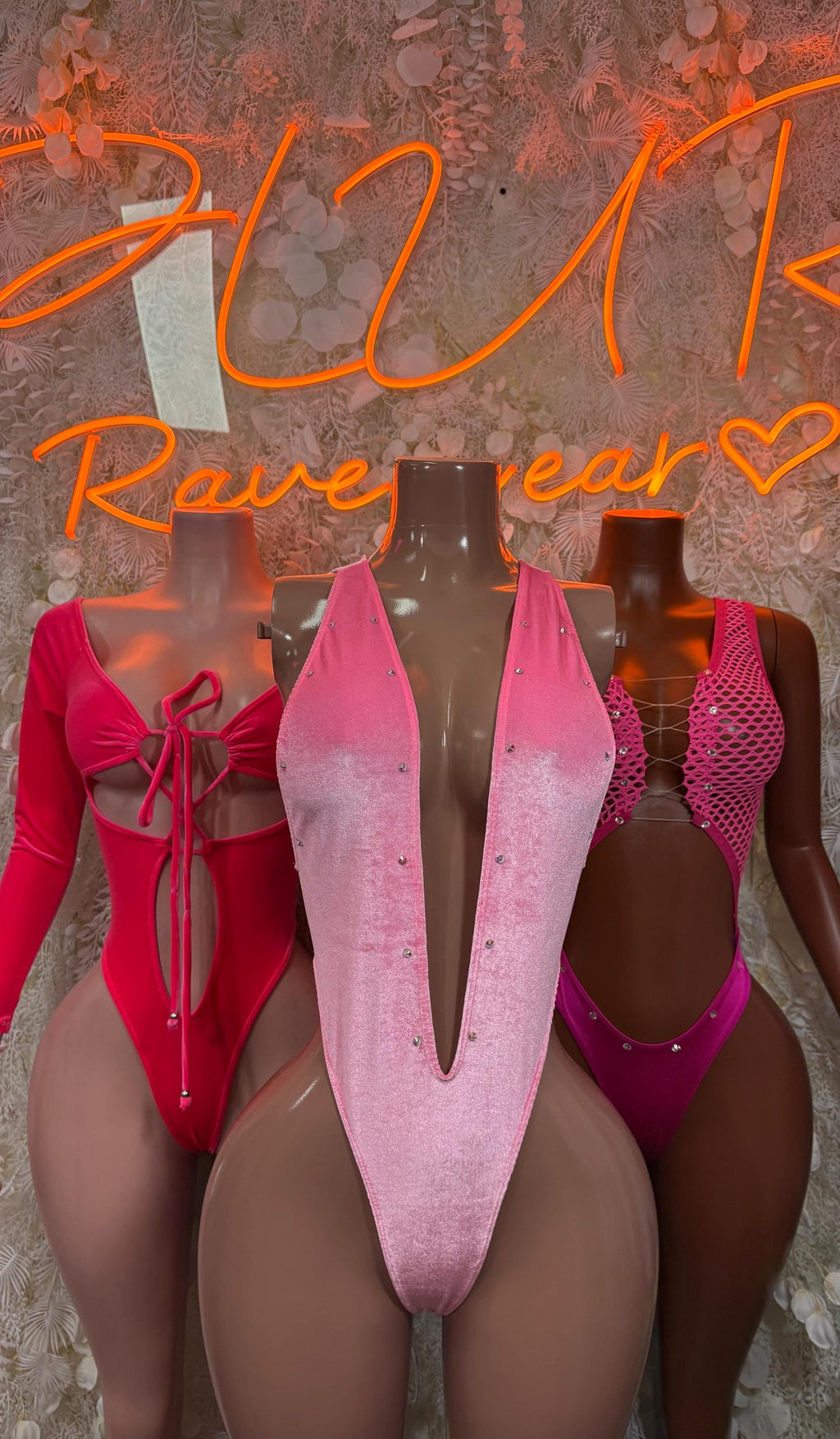 Pink velvet one-piece bodysuit with deep V front and glittery fabric