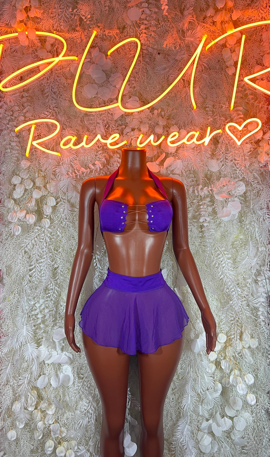 Purple two-piece rave skirt set with sparkly bra top and short pleated skirt