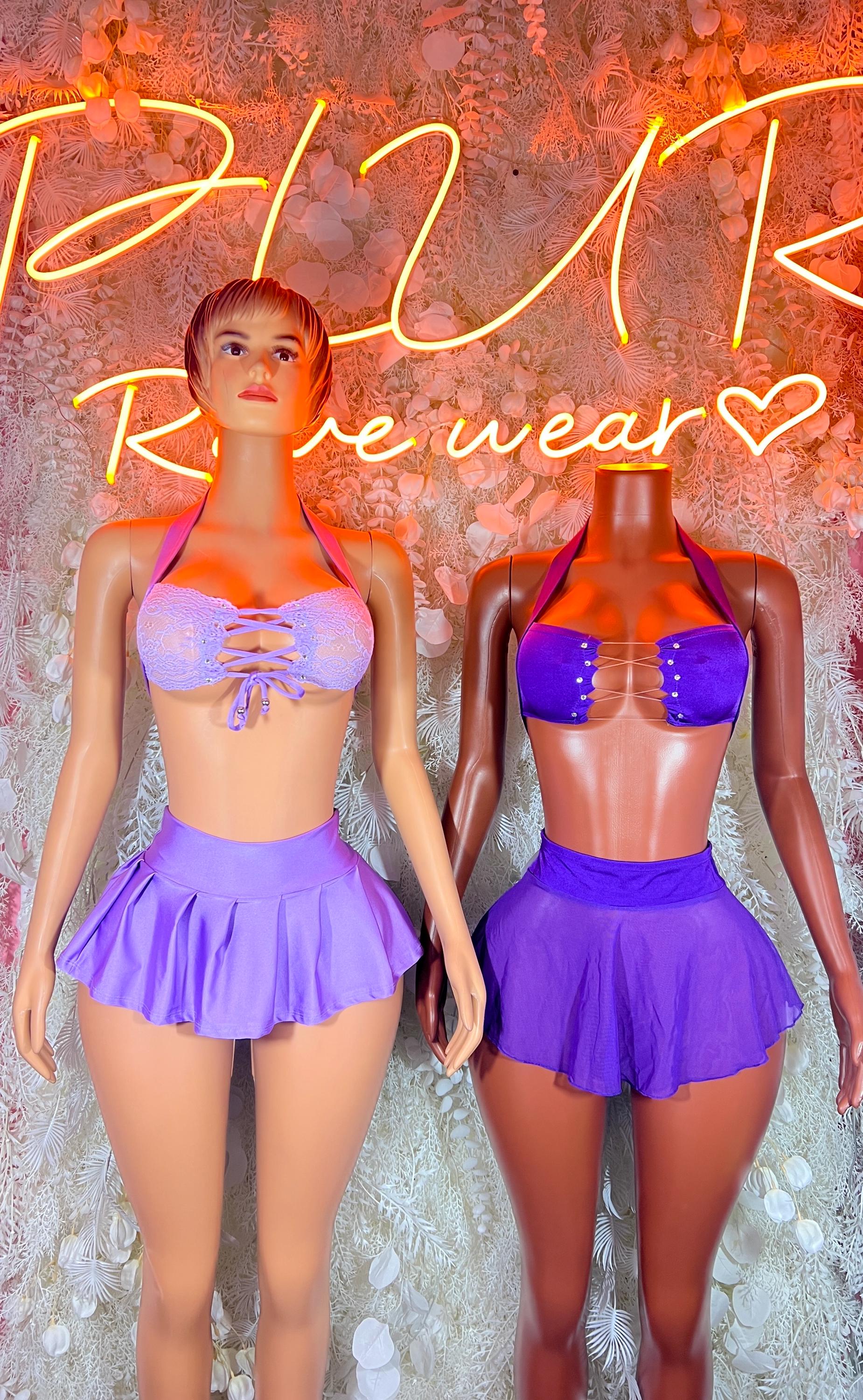 Purple lace bandeau top and pleated mini skirt two-piece outfit on two models