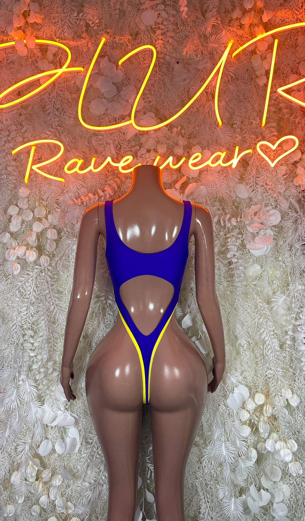 Purple and gold dance bodysuit with open back and crisscross lace-up detail