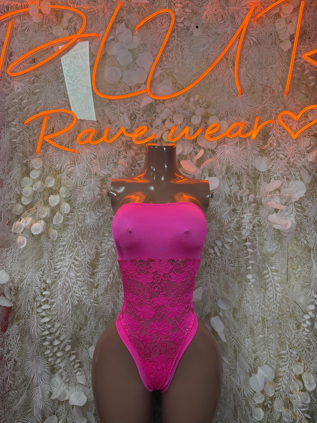Hot pink lace bodysuit with bandeau neckline and high-leg cut