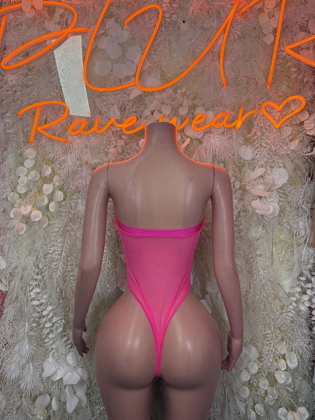 Pink one-piece bodysuit, back view with scoop back and high-cut legs