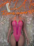 Pink one-piece bodysuit with deep V front and high-cut legs