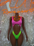 Pink and green one-piece bodysuit with scoop neck and high-cut leg openings
