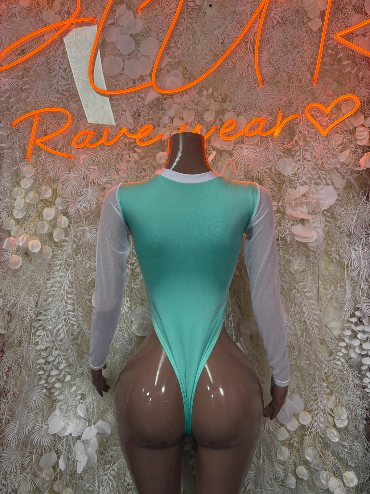 Teal cheetah-print bodysuit with long sheer sleeves, lace-up backless V back