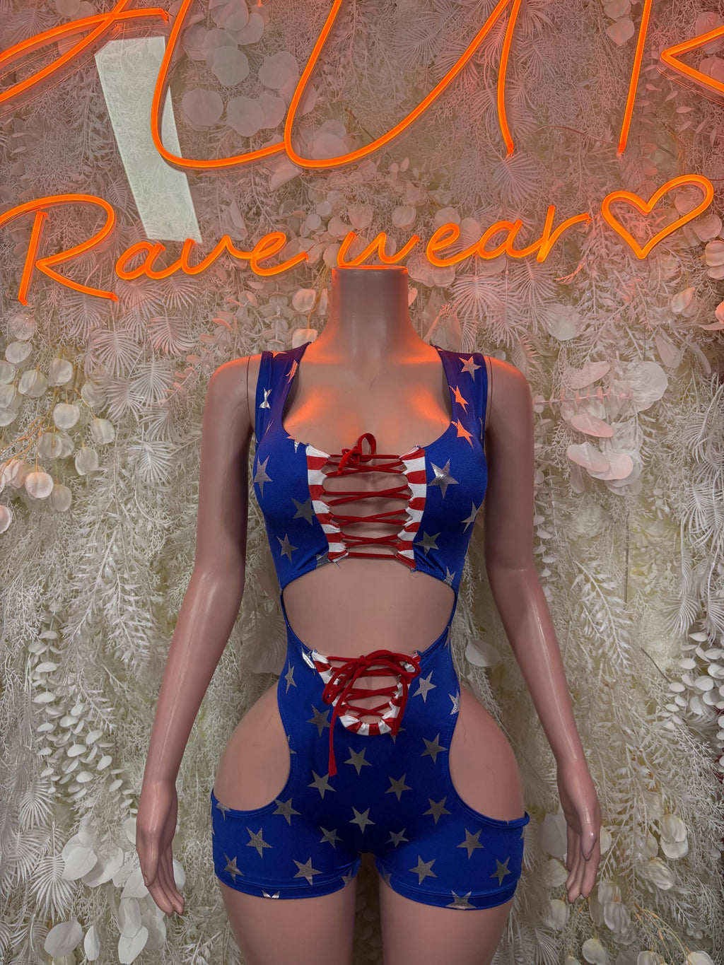 Stars-and-stripes USA flag bodysuit with lace-up front and cutout hip sides