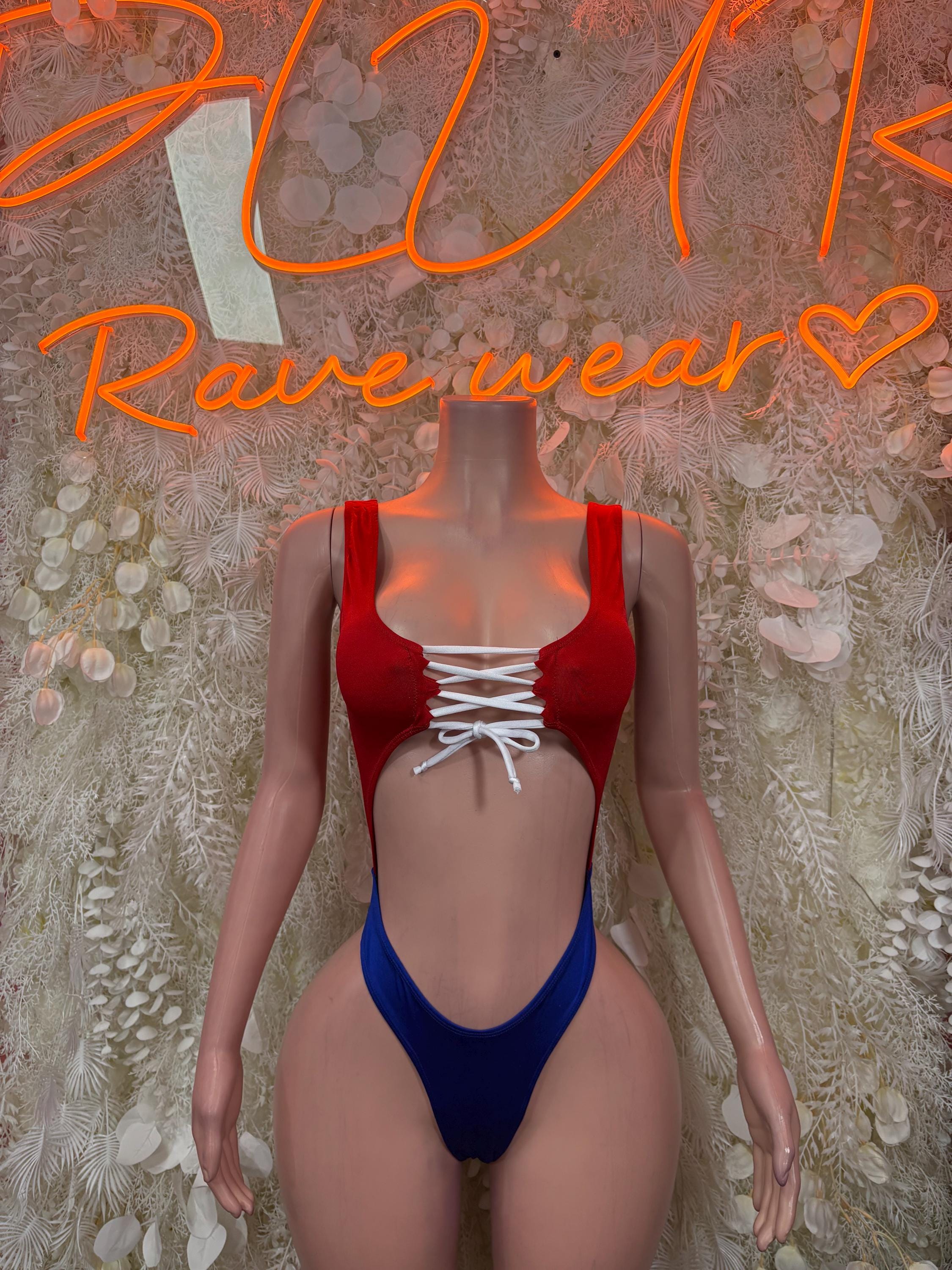 Red triangle top one-piece swimsuit with white lace-up front and blue high-leg bottom