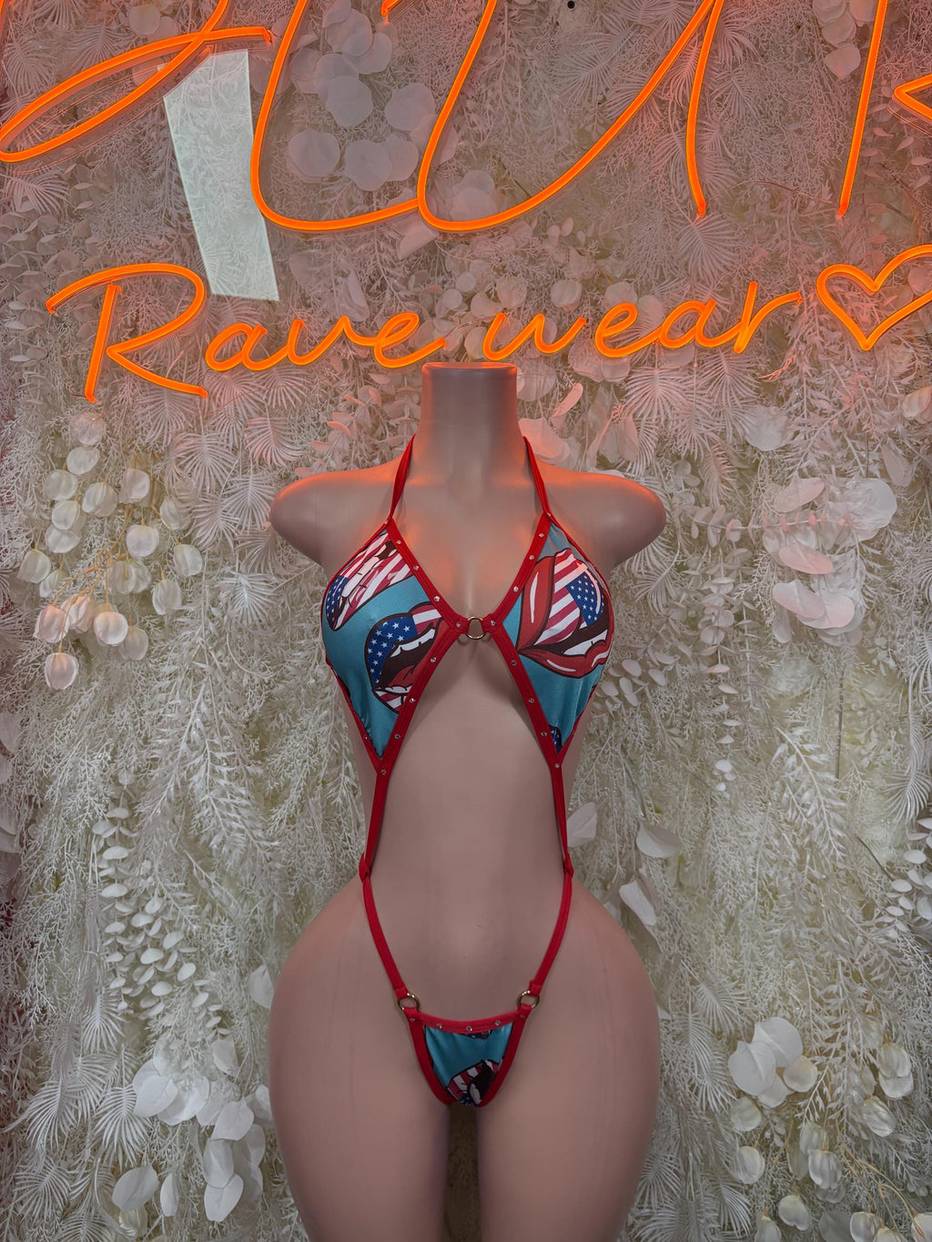 American flag one-piece swimsuit with red, white, and blue triangle cups and tie straps