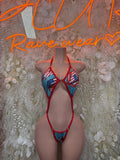 American flag one-piece swimsuit with red, white, and blue triangle cups and tie straps