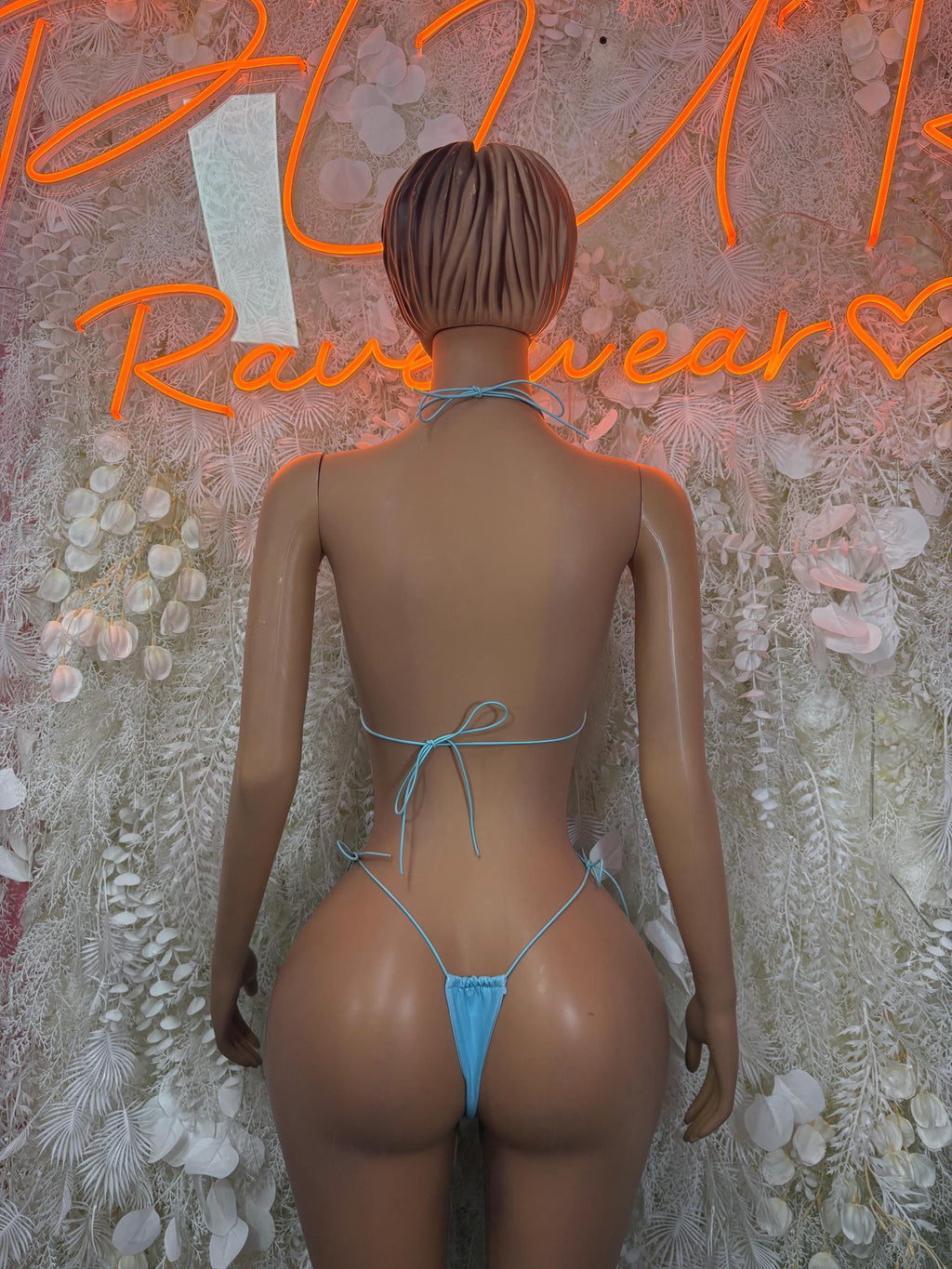 Teal bikini set shown from back, tie-string top and tie-back thong bottoms