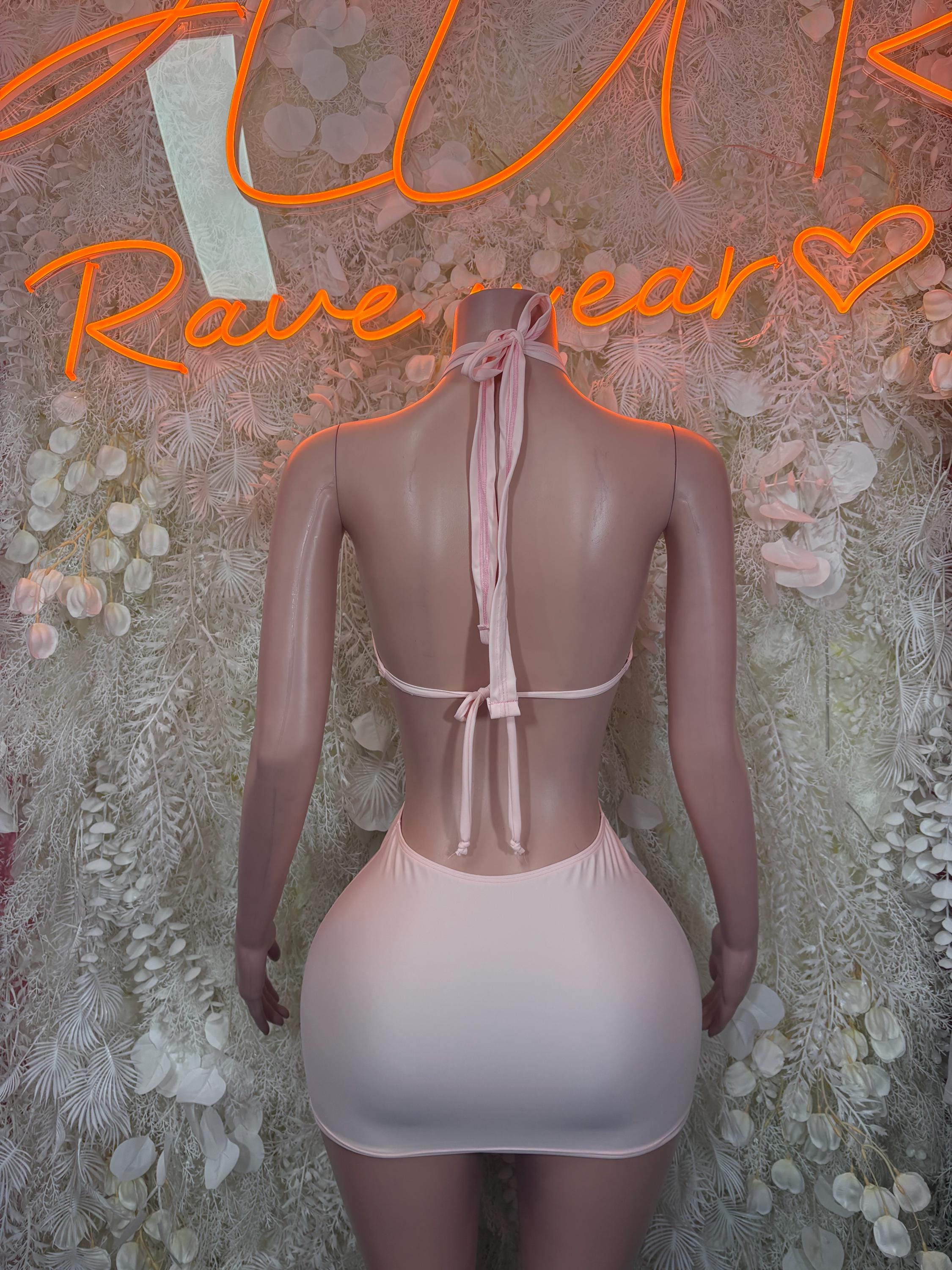 Nude backless mini dress with tie-back straps and V-shaped back cutout